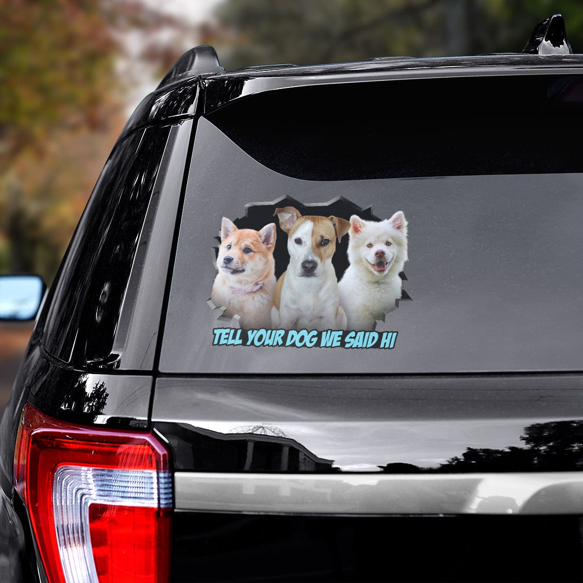 Custom 3 pet dog decals on a black car window, featuring a cartoon style and "Tell Your Dog We Said Hi" text.