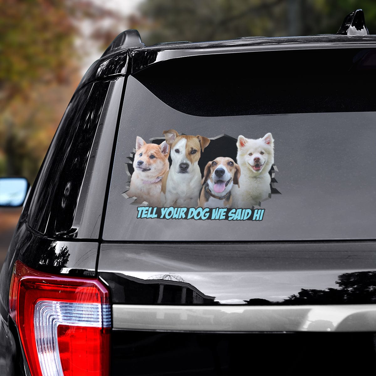 Custom 4 pet dog decal on a black car window with "Tell Your Dog We Said Hi" text.