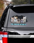 Custom pet decals featuring five dogs in a cracked window design on a black SUV.
