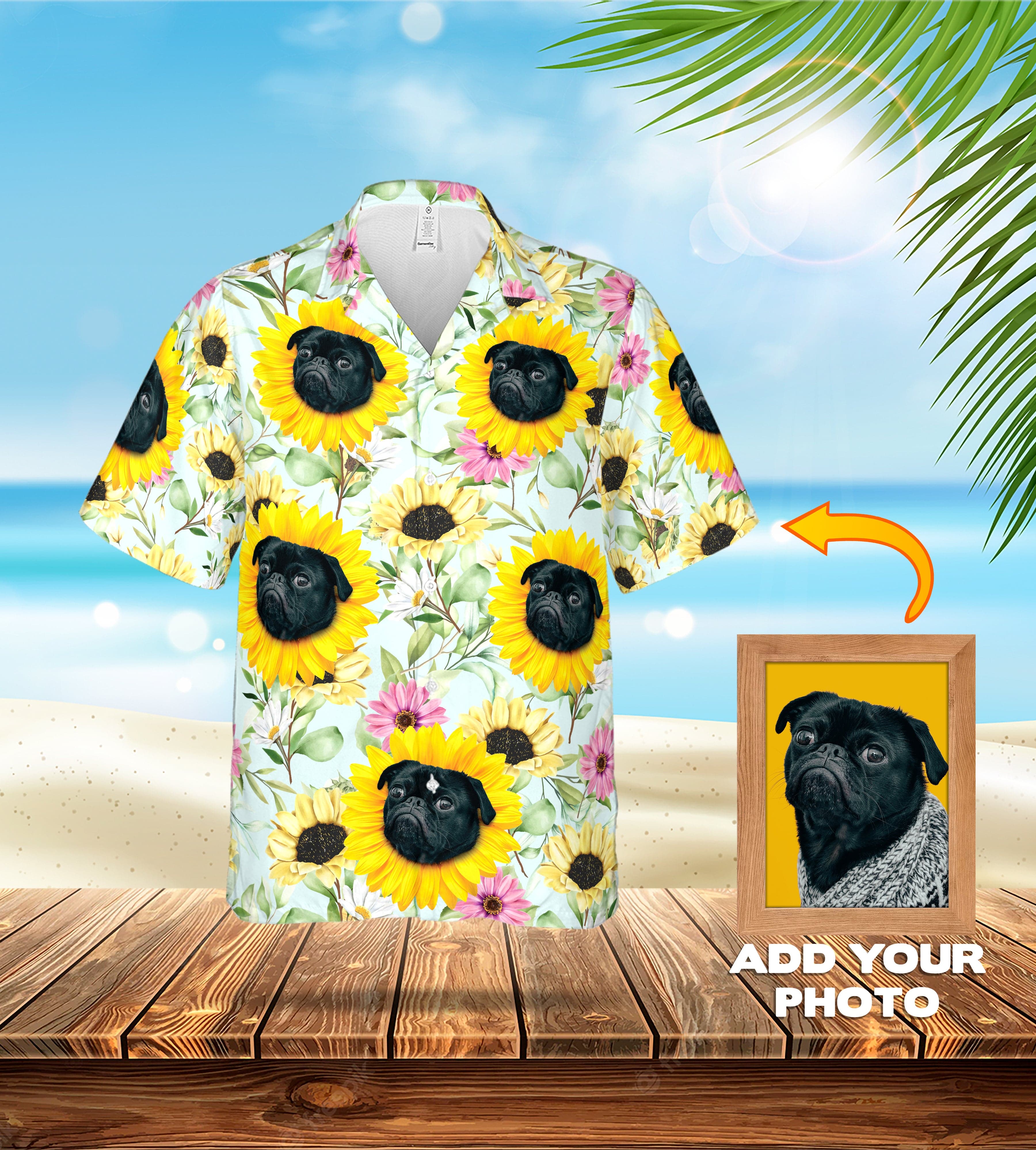 Custom Hawaiian shirt with black pug portraits in sunflowers on a light blue background, shown on a beach.