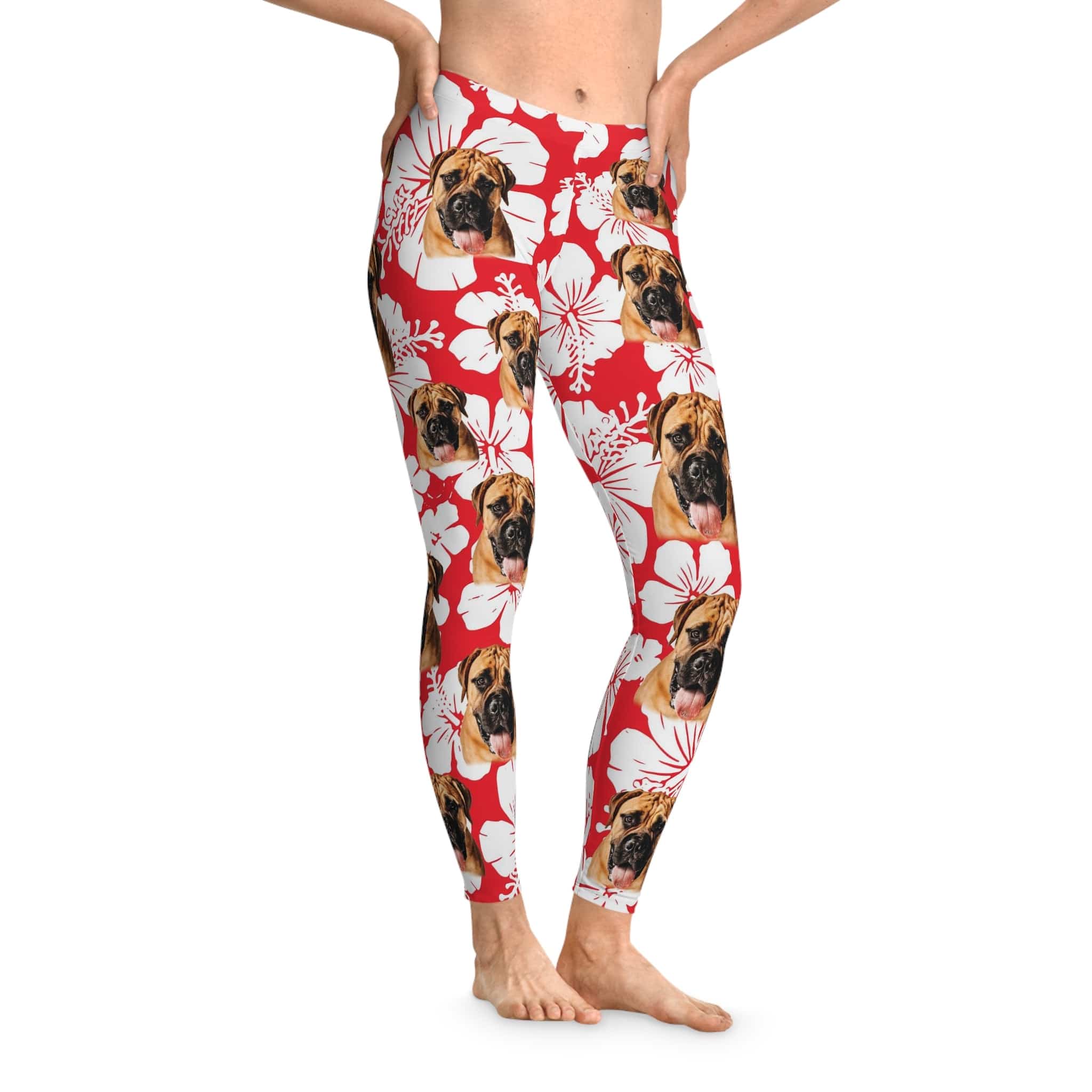 Red custom leggings with white hibiscus flowers and multiple boxer dog faces.