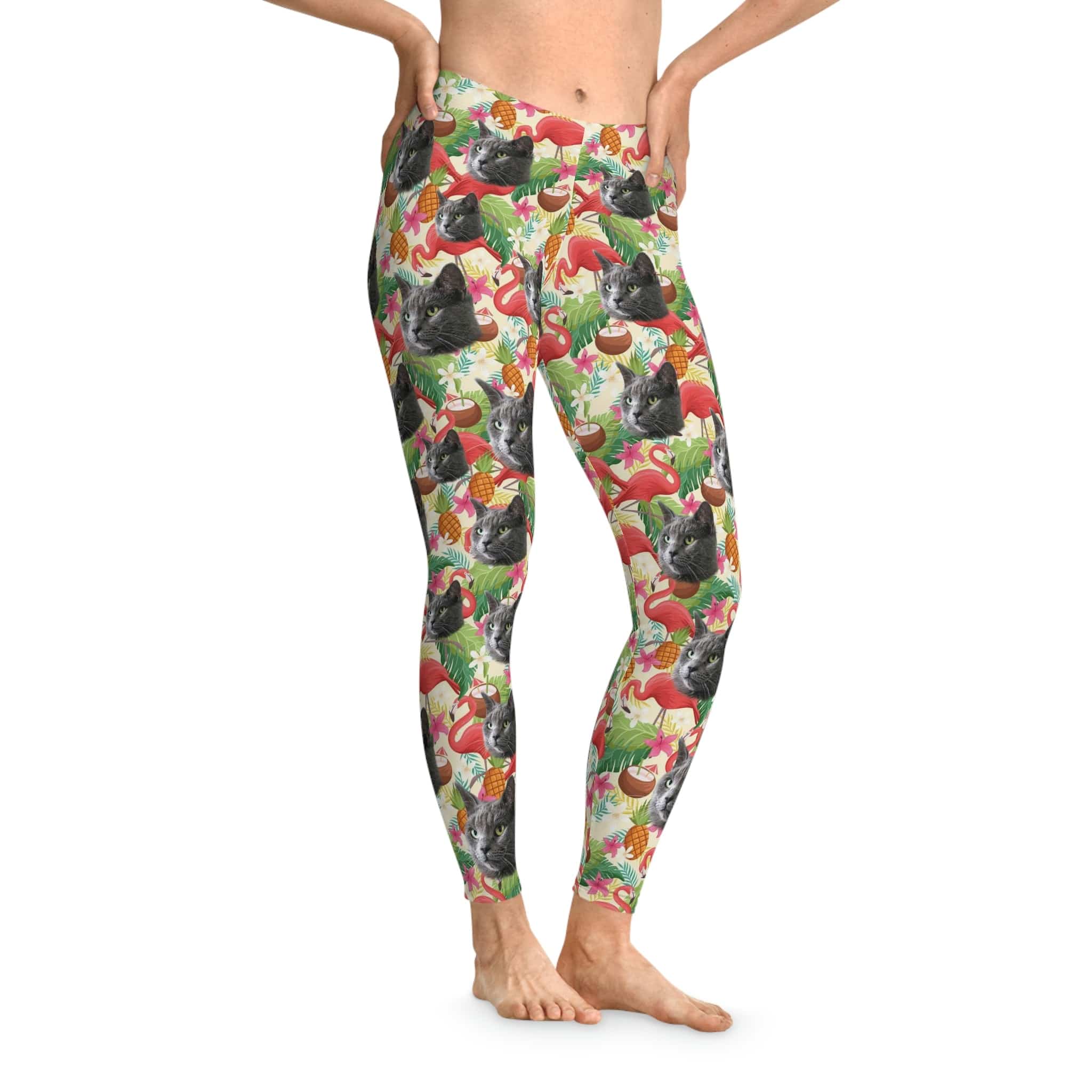 Custom leggings with a "Flamingo Paradise" pattern featuring multiple gray cat faces, pineapples, and flamingos.