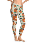 Custom Halloween pumpkin leggings with dogs, bats, and candy on a light background.