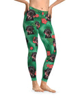 Trident green custom leggings with a repeating pattern of black dogs, tropical leaves, and red hibiscus flowers.