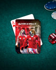 Personalized playing card with two dogs in red soccer uniforms, named Oliver & Molly, on a green poker table.