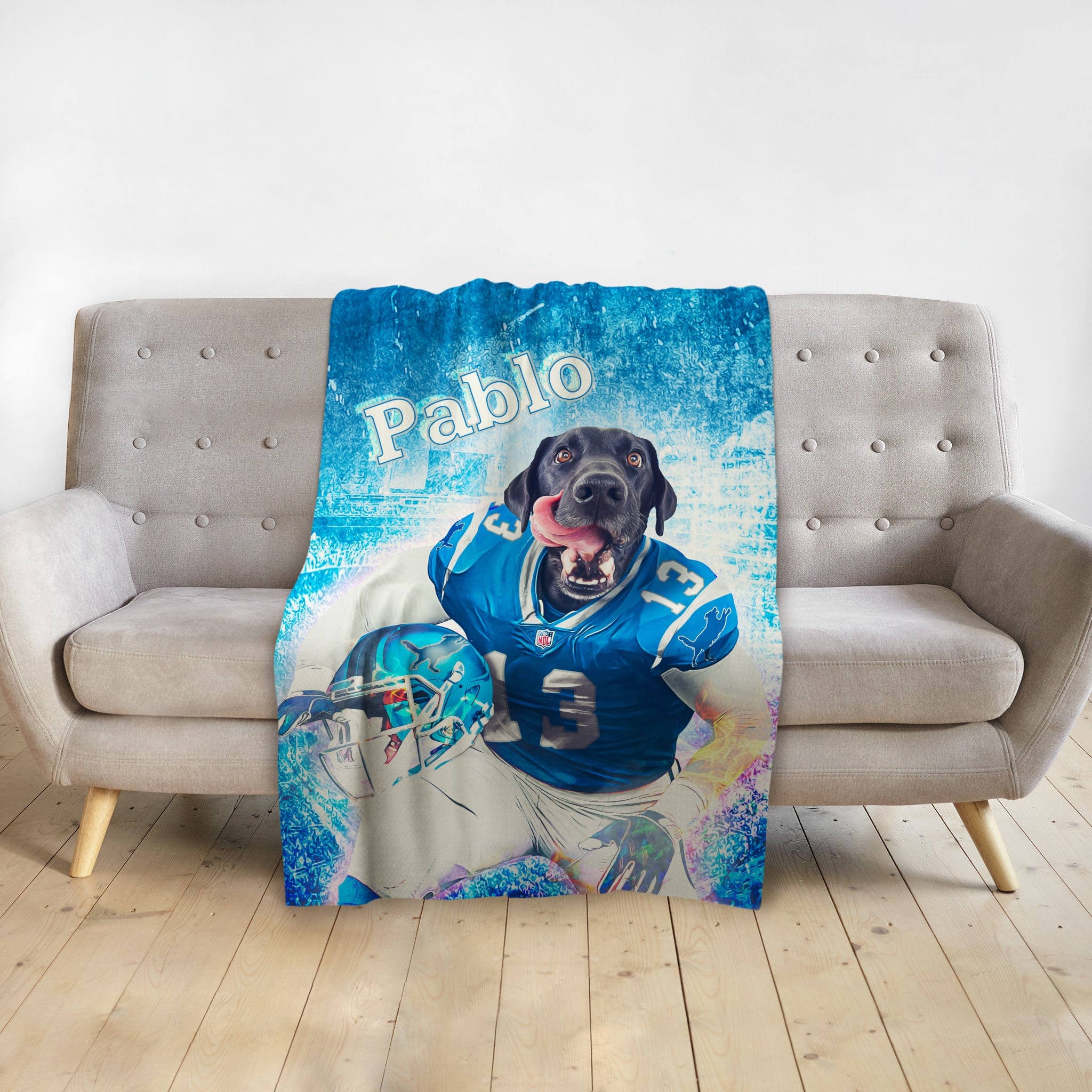 Personalized pet blanket with a black dog in a blue football uniform, named "Pablo.