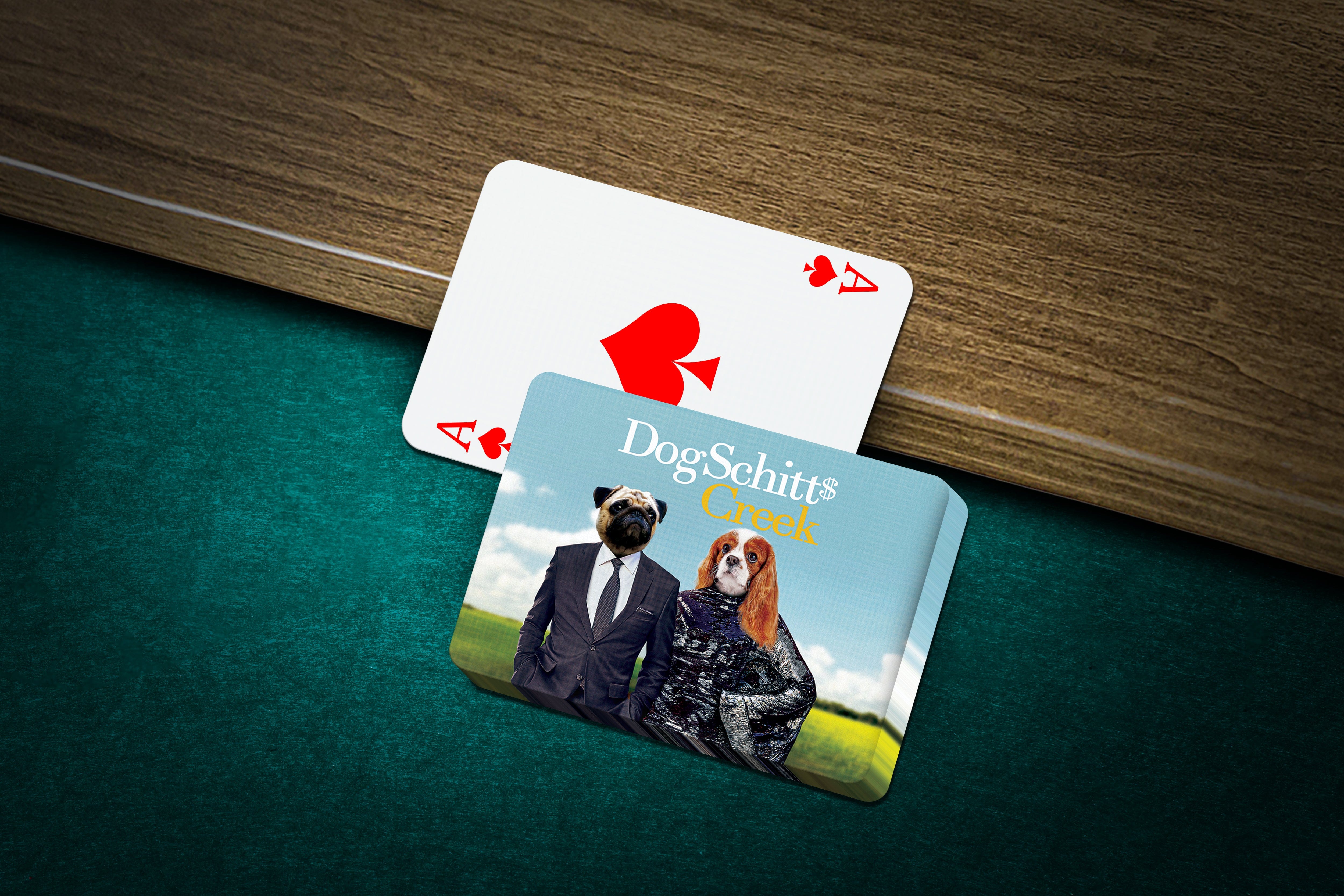 Personalized playing cards featuring custom pet portraits of a pug in a suit and a cavalier king charles spaniel.