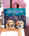 Personalized 'Doggos of Los Angeles' tote bag with two custom dog portraits and city skyline.