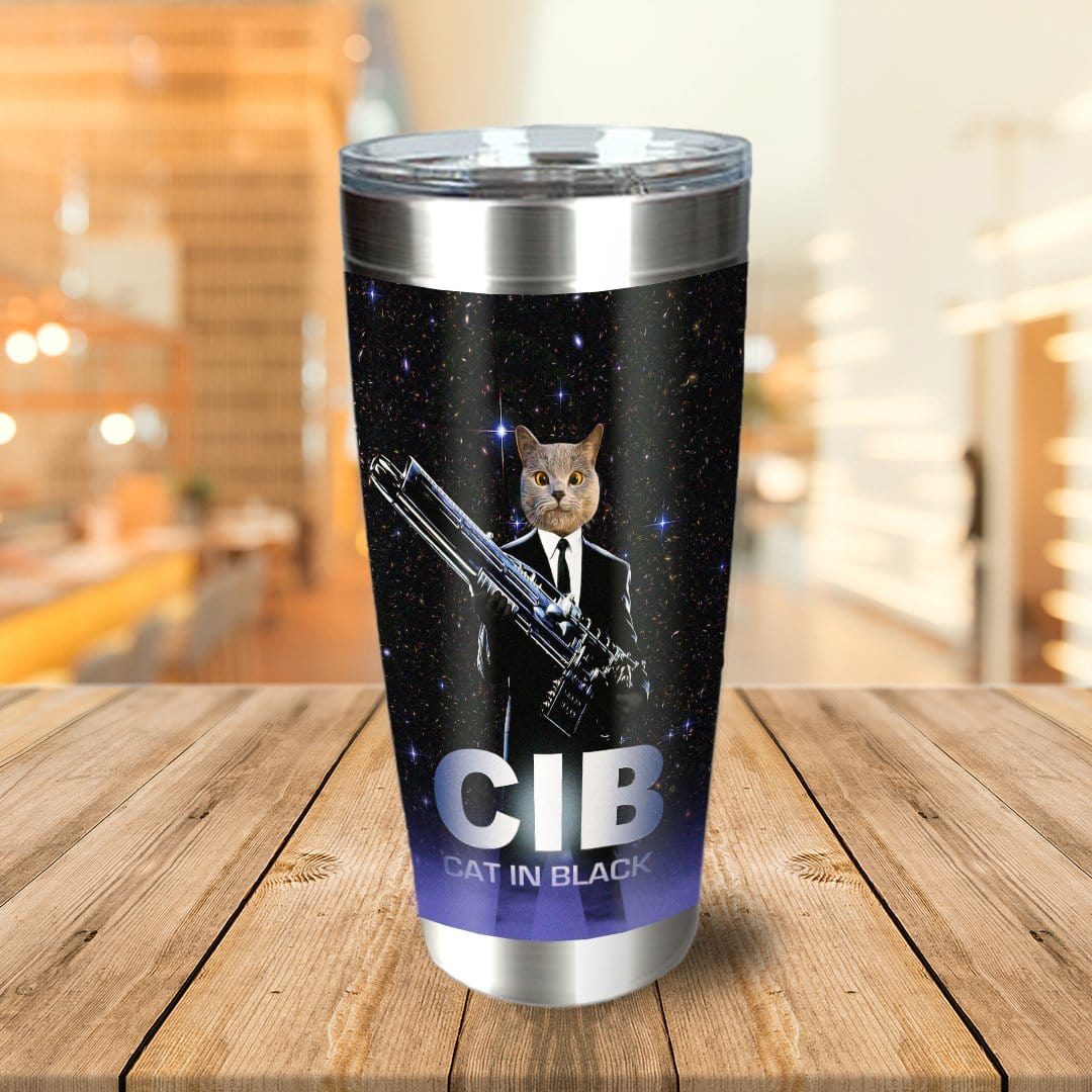 Personalized stainless steel tumbler with a custom cat portrait in a black suit, holding a weapon, against a starry background.
