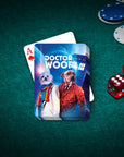 Personalized Dr. Woof playing cards featuring two custom pet portraits in a Doctor Who style, on a green felt table with poker chips and dice.