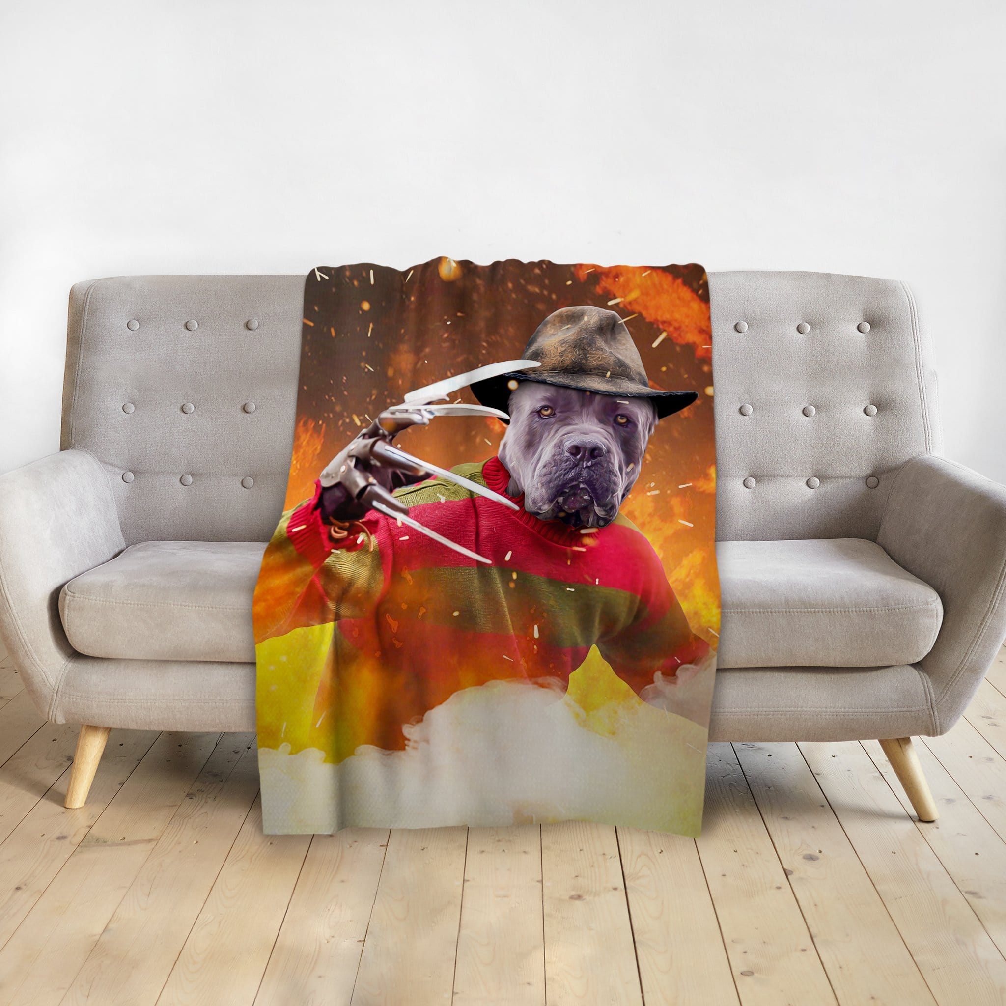 Personalized Freddy Woofer pet blanket featuring a dog in a Freddy Krueger portrait style, draped over a gray couch.
