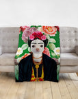 Personalized pet blanket featuring a dog's face in a Frida Kahlo-style portrait with a floral background.