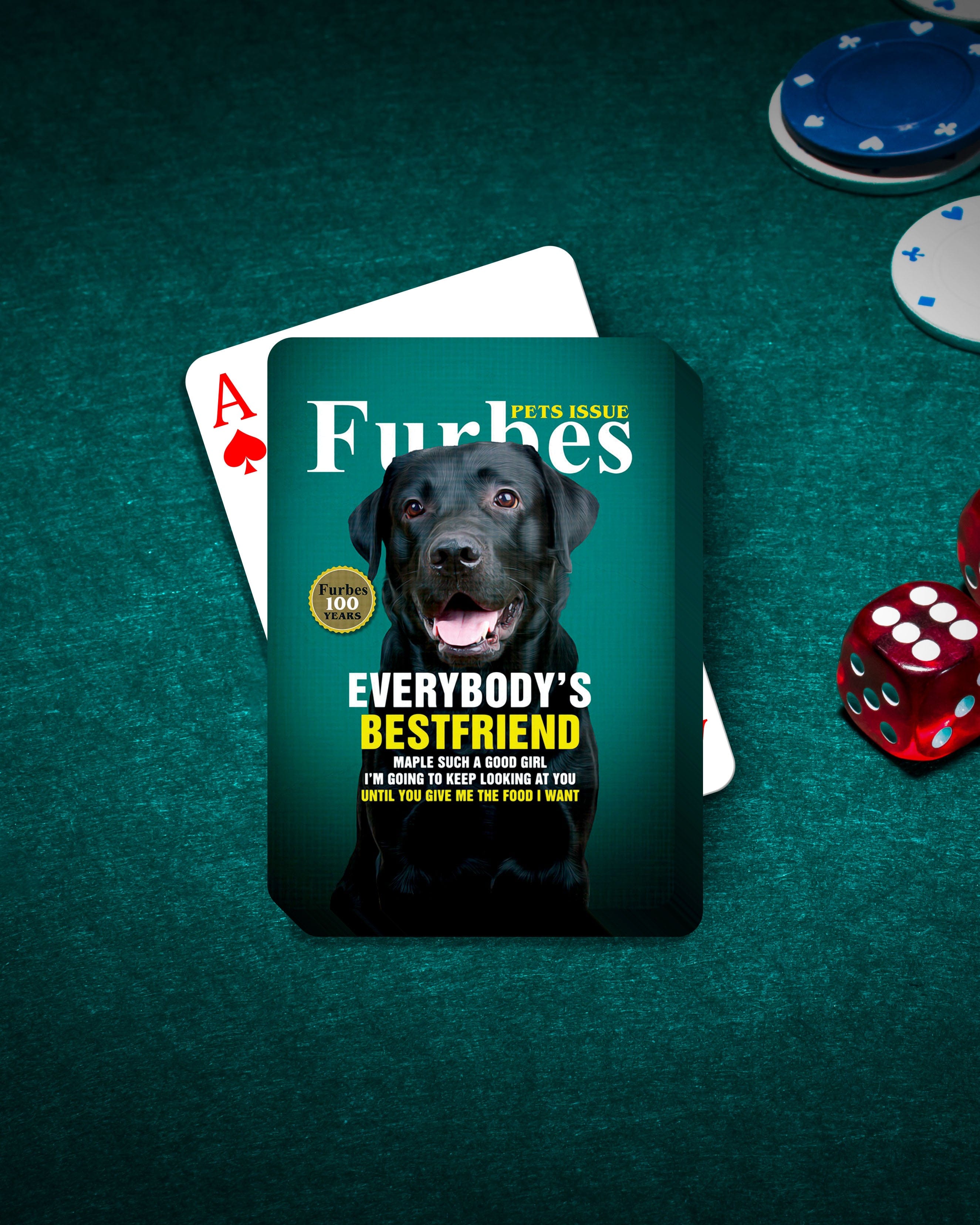 Custom 'Furbes' playing cards featuring a black Labrador dog portrait on a green felt table with poker chips and dice.