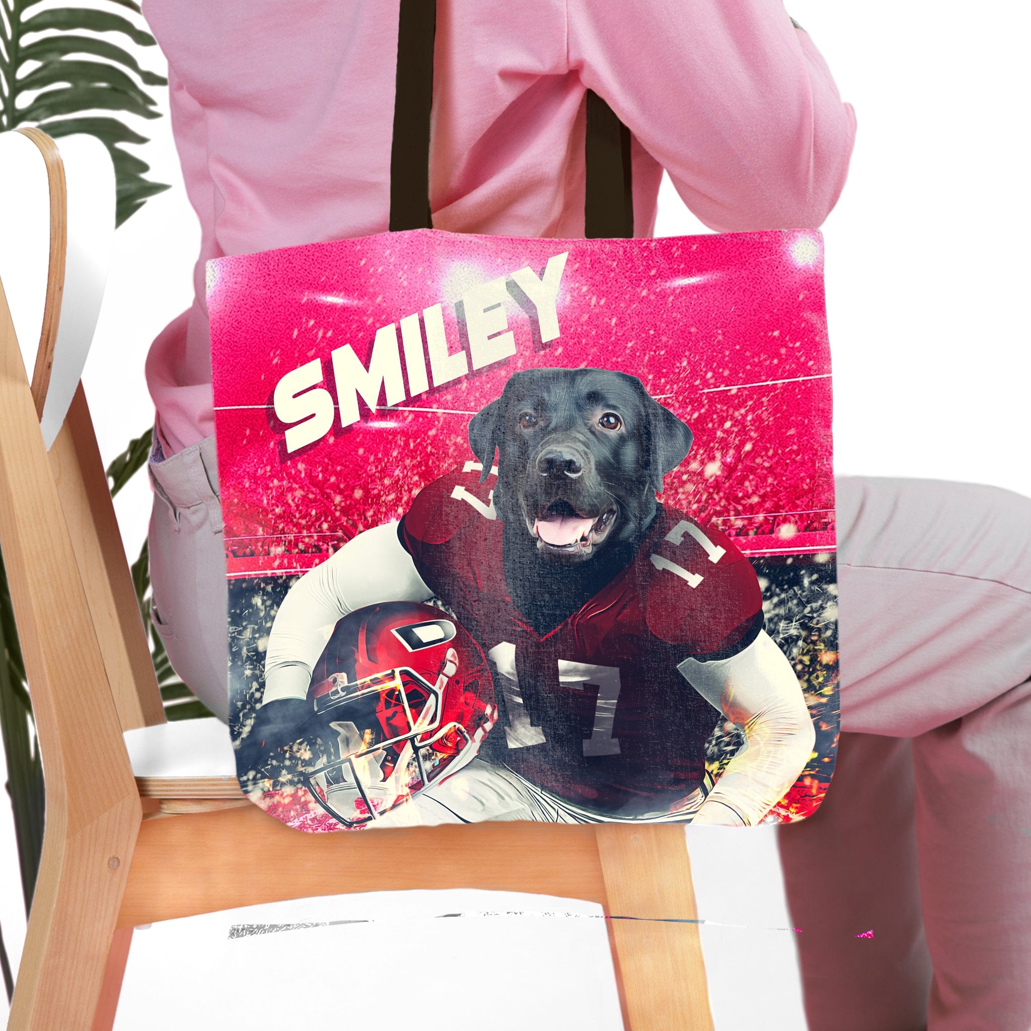 Personalized tote bag with a black dog in a football uniform on a stadium background.