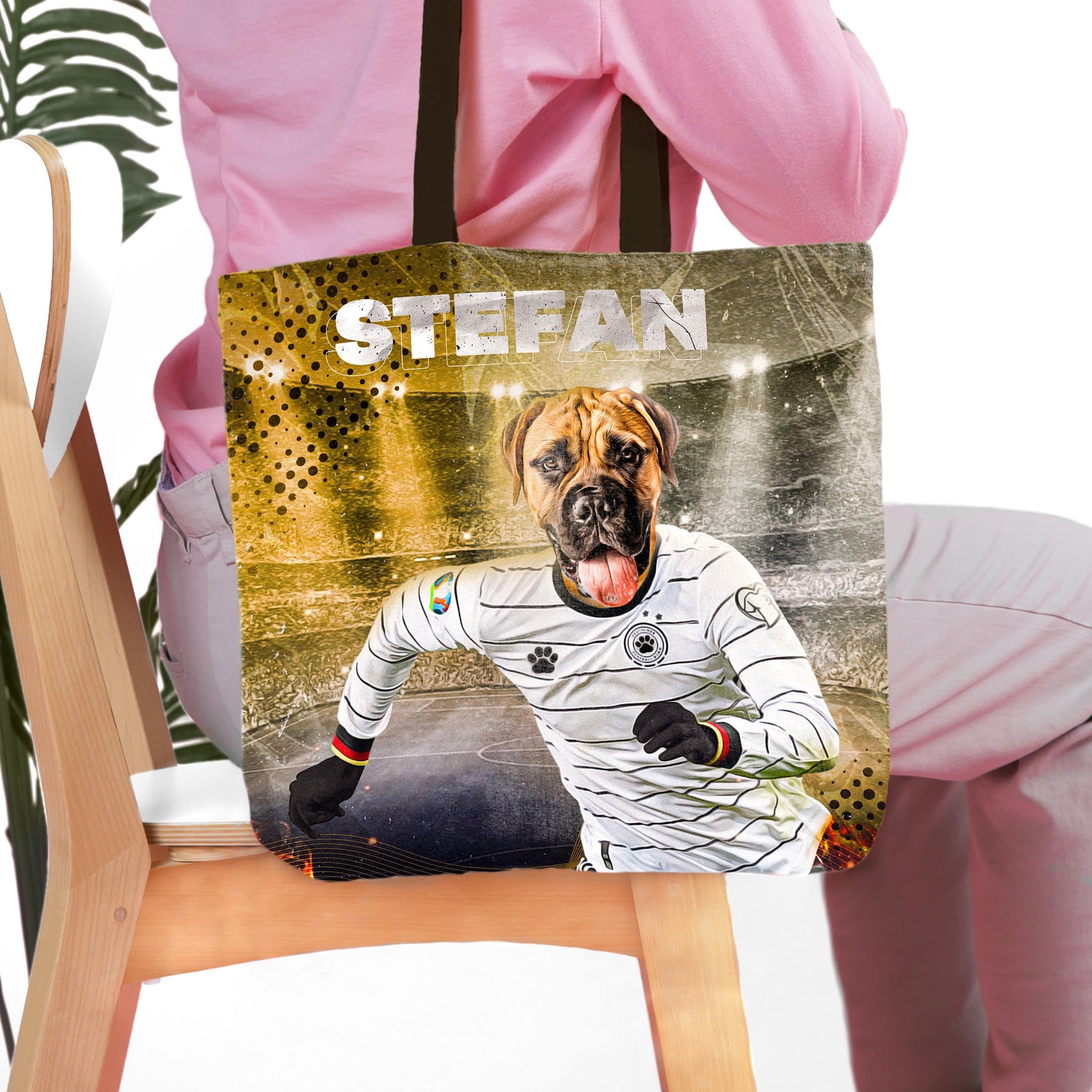 Personalized tote bag with a dog's portrait as a German soccer player, stadium background, and "STEFAN" text.