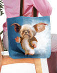 Personalized tote bag with a custom Gizmo-style dog portrait on a blue background.
