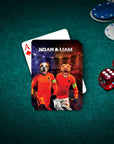 Personalized playing card with two custom pet portraits in orange soccer jerseys, on a green poker table.