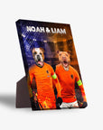 Personalized 2-pet standing canvas featuring dogs in orange Holland soccer jerseys with "Noah & Liam" at the top.