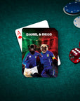 Personalized playing cards featuring two pugs in soccer uniforms, "Daniel & Diego," on a green poker table.
