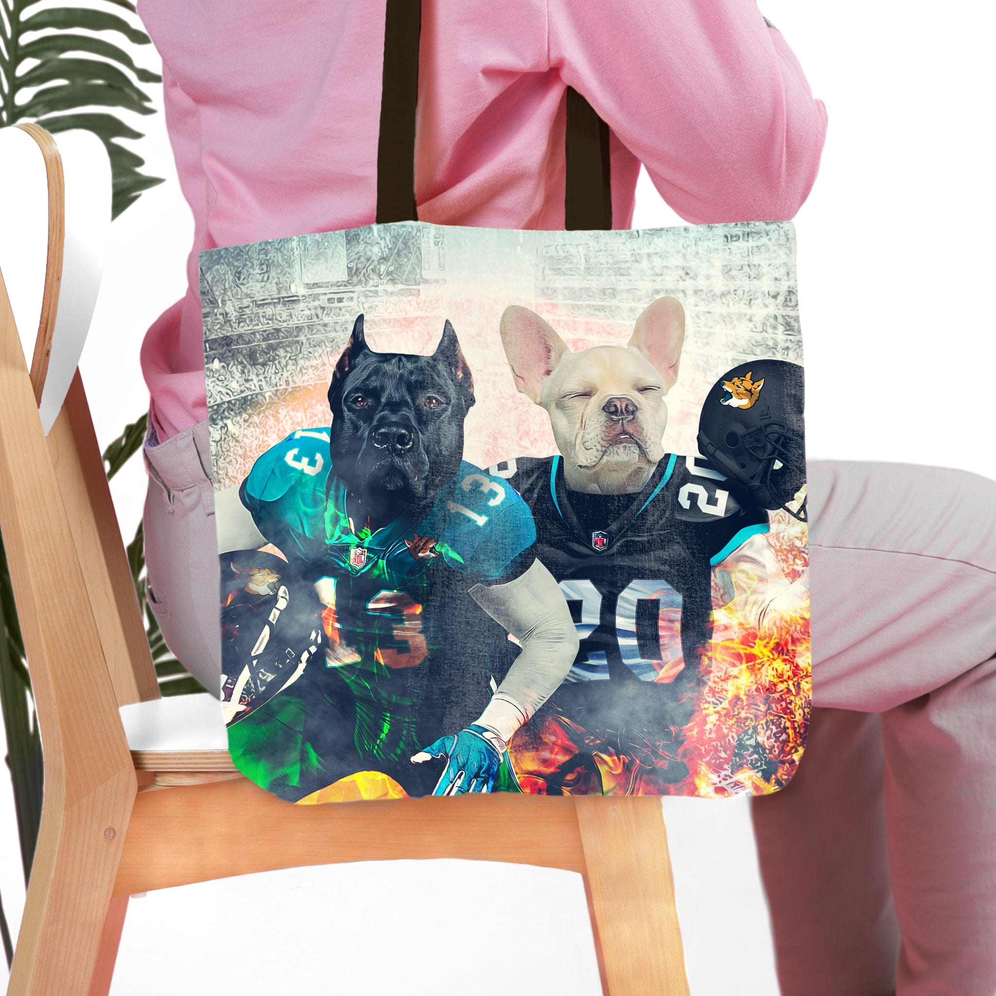 Personalized tote bag with two dog portraits in Jacksonville Doggos football uniforms.