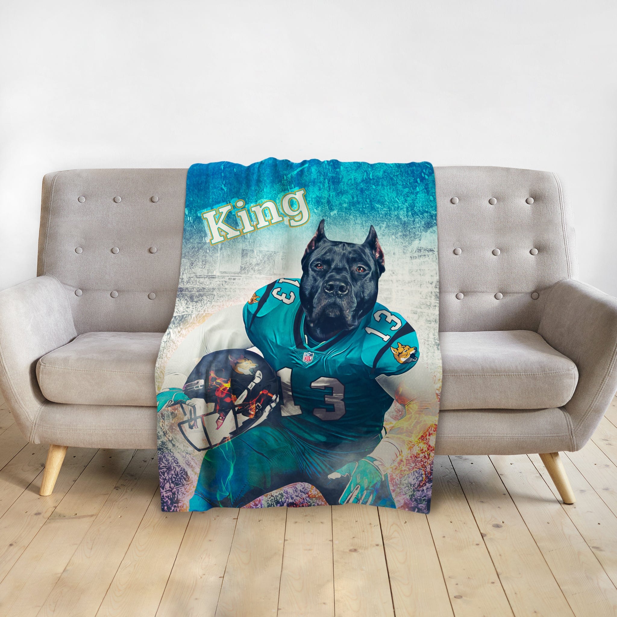 Personalized pet blanket with a Doggovinci portrait of a black dog in a teal football uniform.