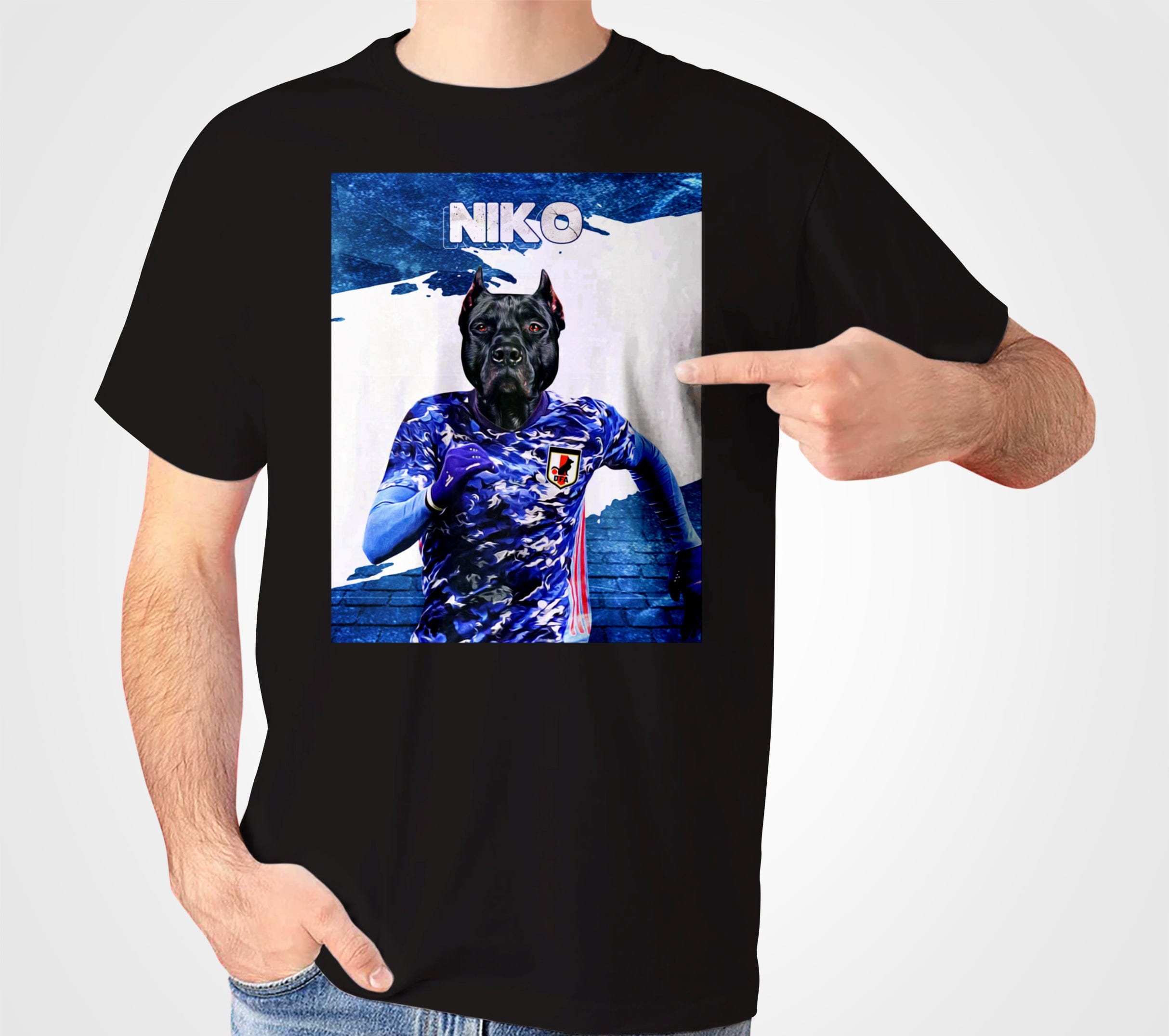 Black personalized pet t-shirt featuring a dark dog in a blue Japanese soccer jersey, with "NIKO" above.