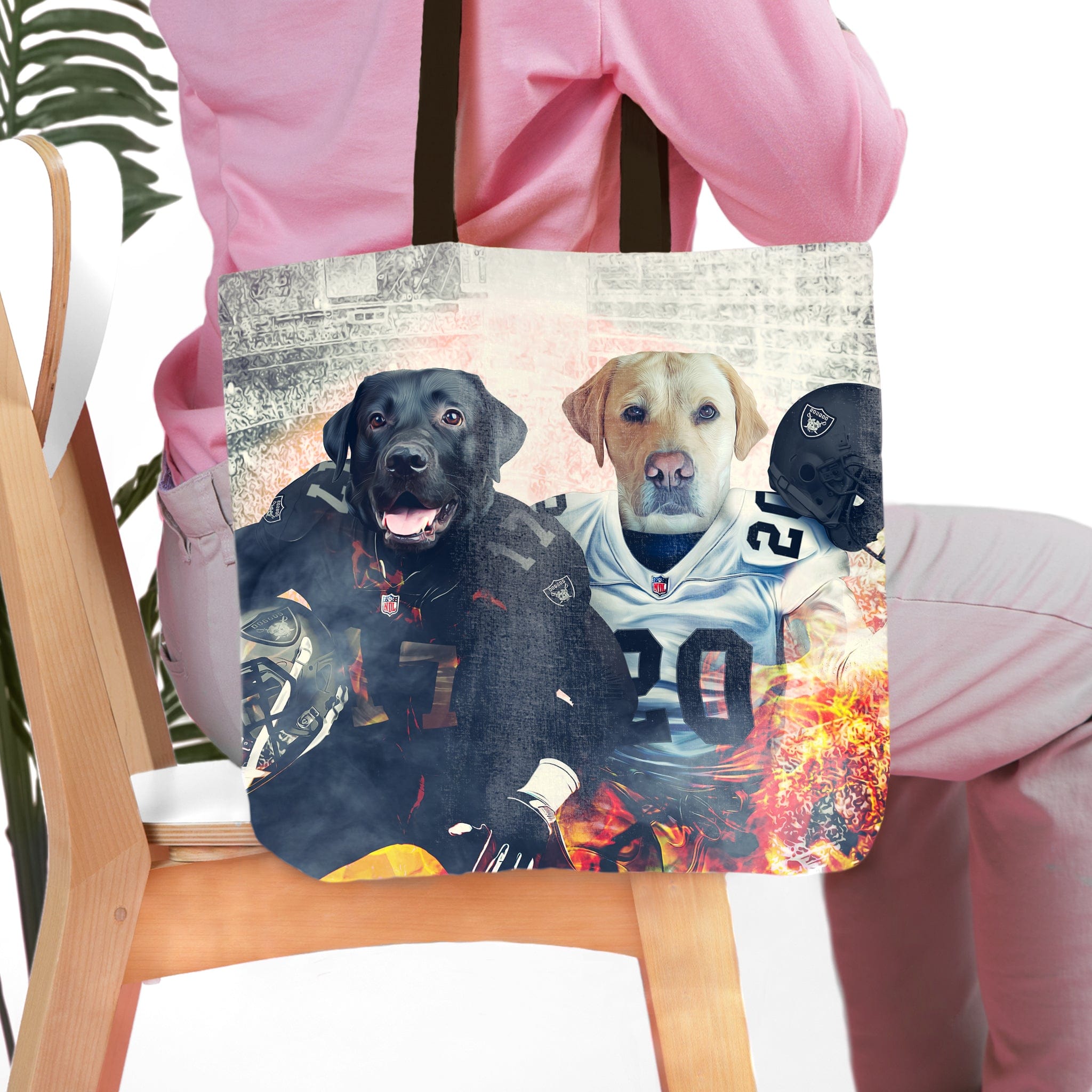Personalized tote bag with two dog portraits in Las Vegas Raiders football uniforms.
