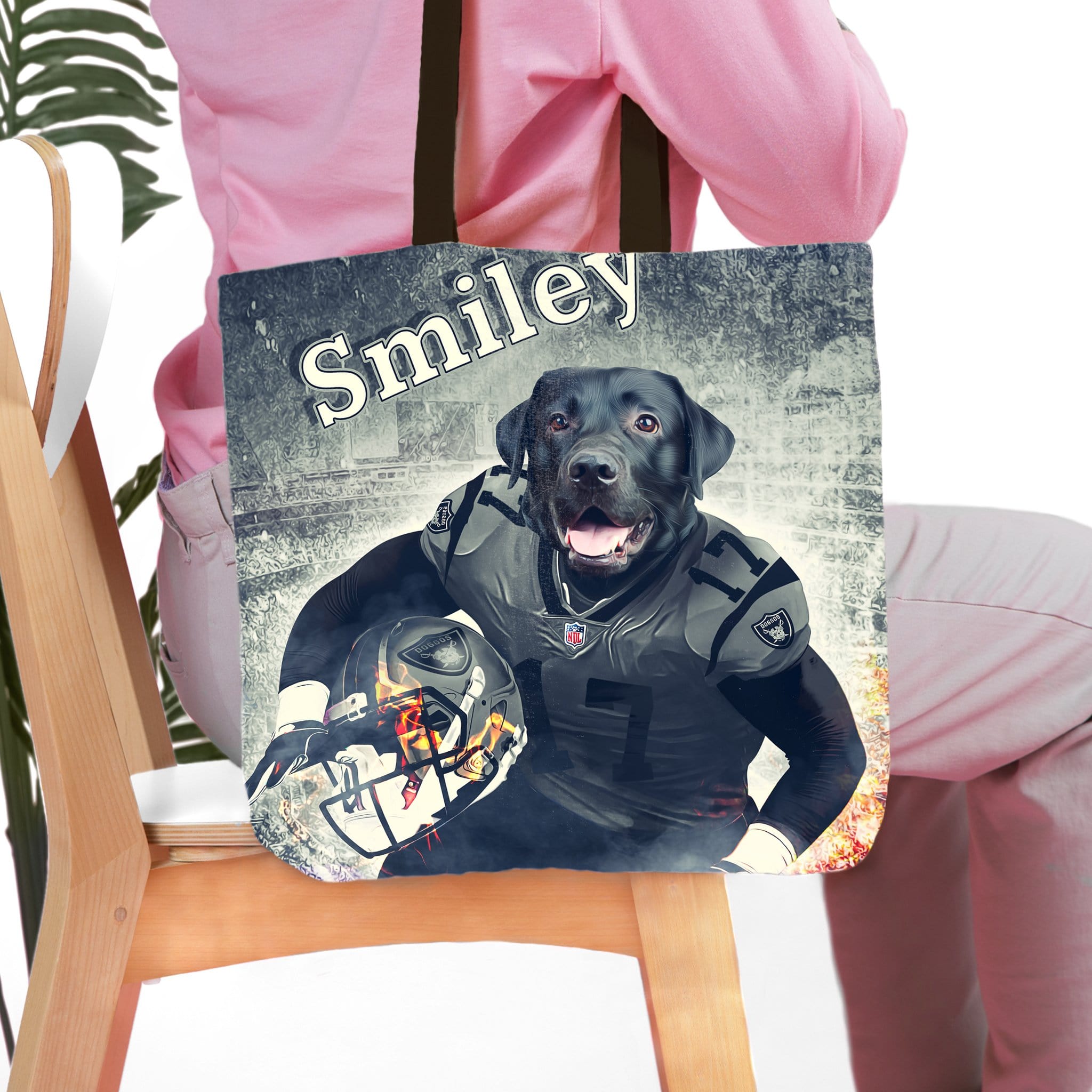 Personalized black dog portrait tote bag in a football uniform, with "Smiley" text.