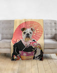 Personalized pet blanket featuring a bulldog in a black kimono with a red umbrella, draped over a gray sofa.
