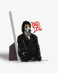 Personalized pet standing canvas featuring a dog's head on a "Michael Wooferson" body in a black leather jacket, with "BAD DOG" in red text.