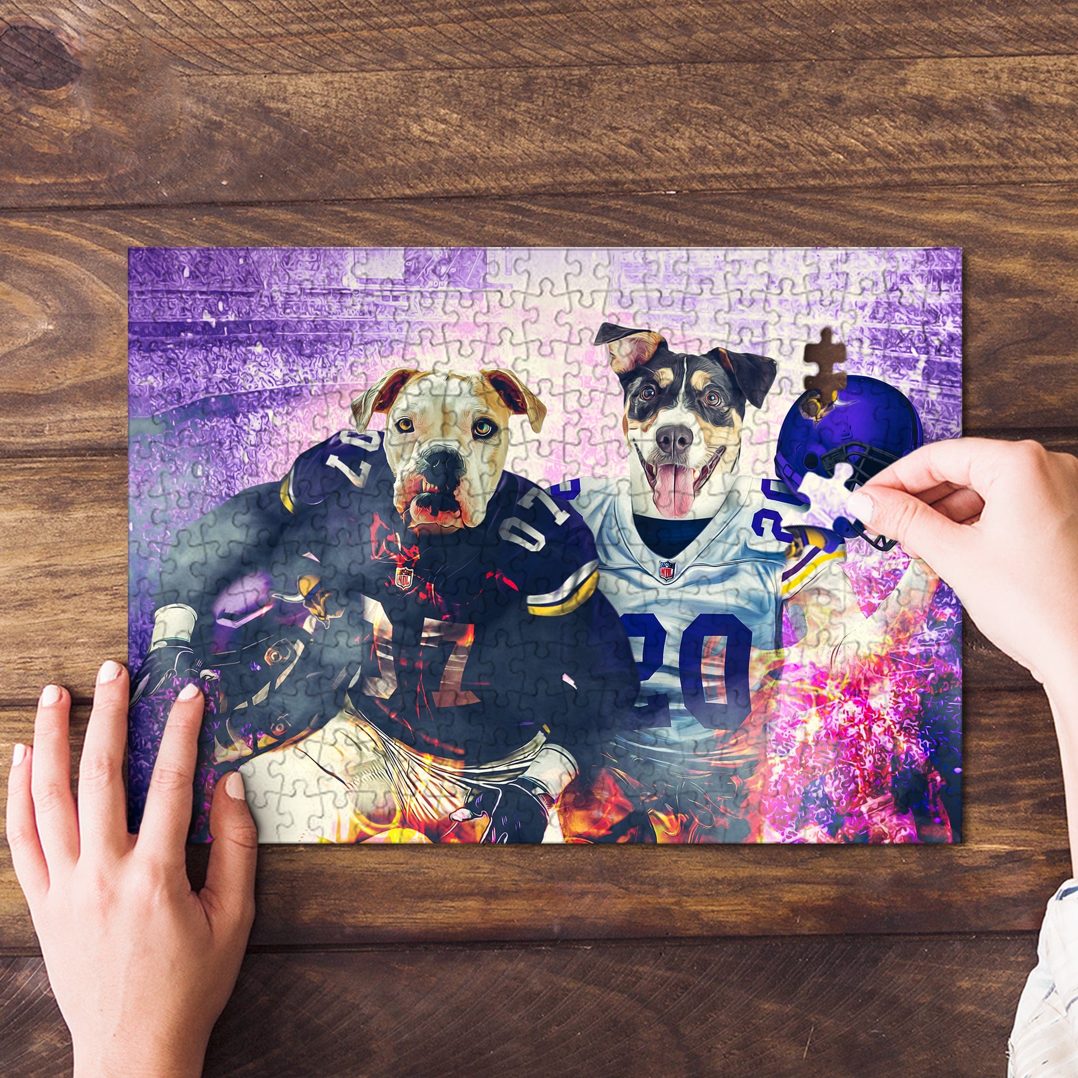 Personalized 2 pet puzzle featuring two dogs in football jerseys, one piece being placed.