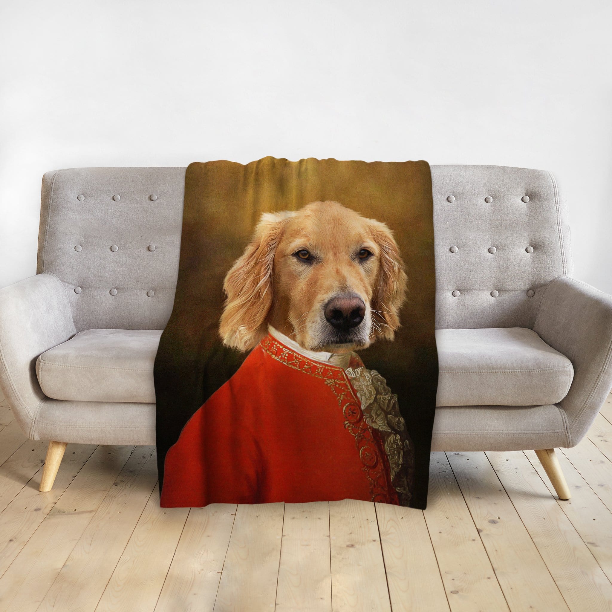 Personalized Golden Retriever royal portrait blanket draped over a gray sofa.
