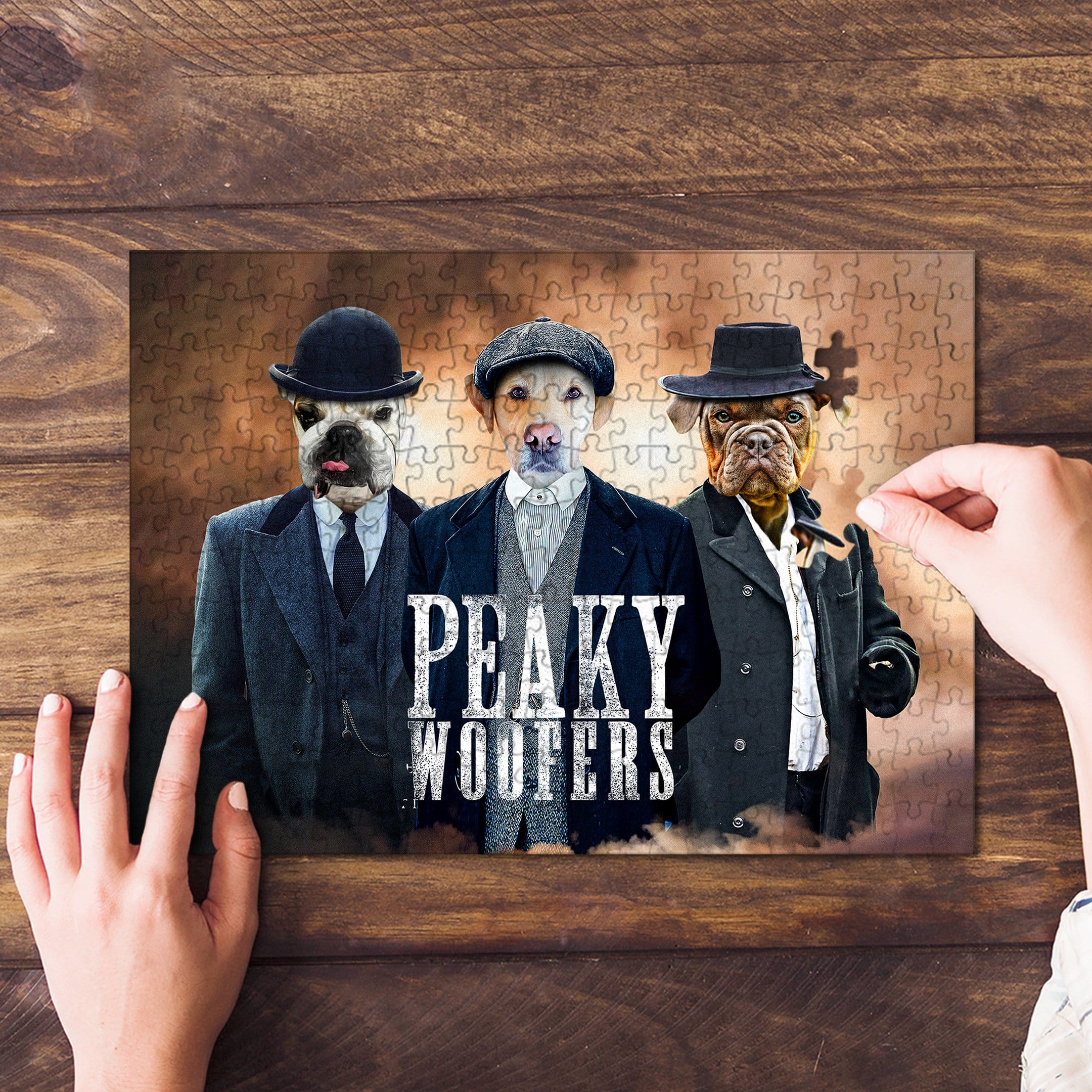 Personalized 3-pet puzzle featuring dogs in "Peaky Woofers" style, with a hand placing a piece.