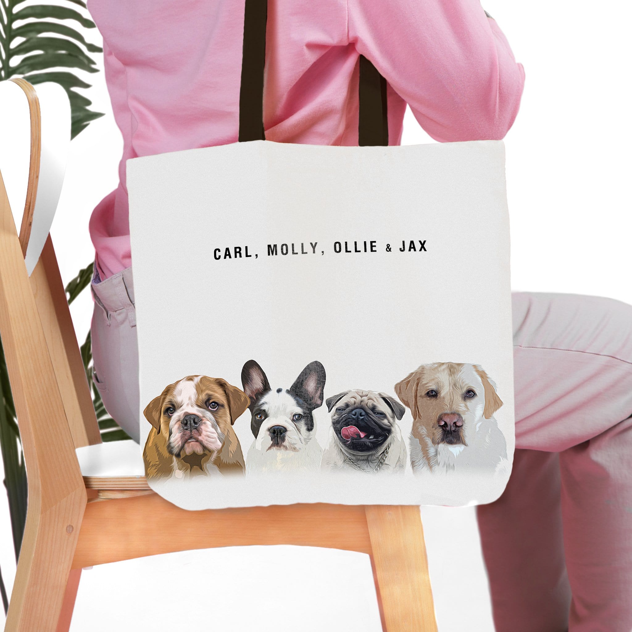 Personalized white canvas tote bag with custom watercolor portraits of four dogs and their names.