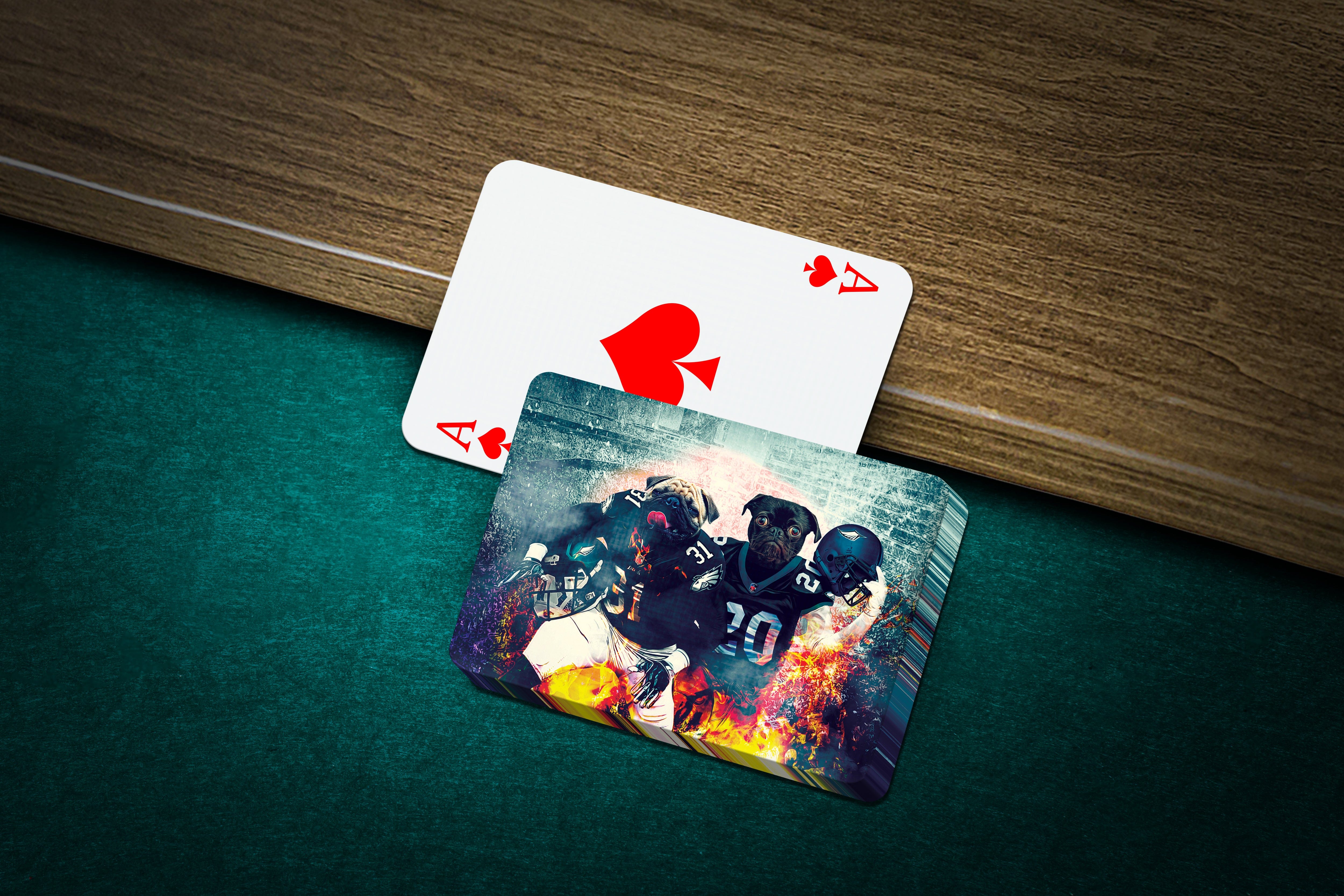 Personalized playing cards featuring custom dog portraits in football uniforms with a fiery background.