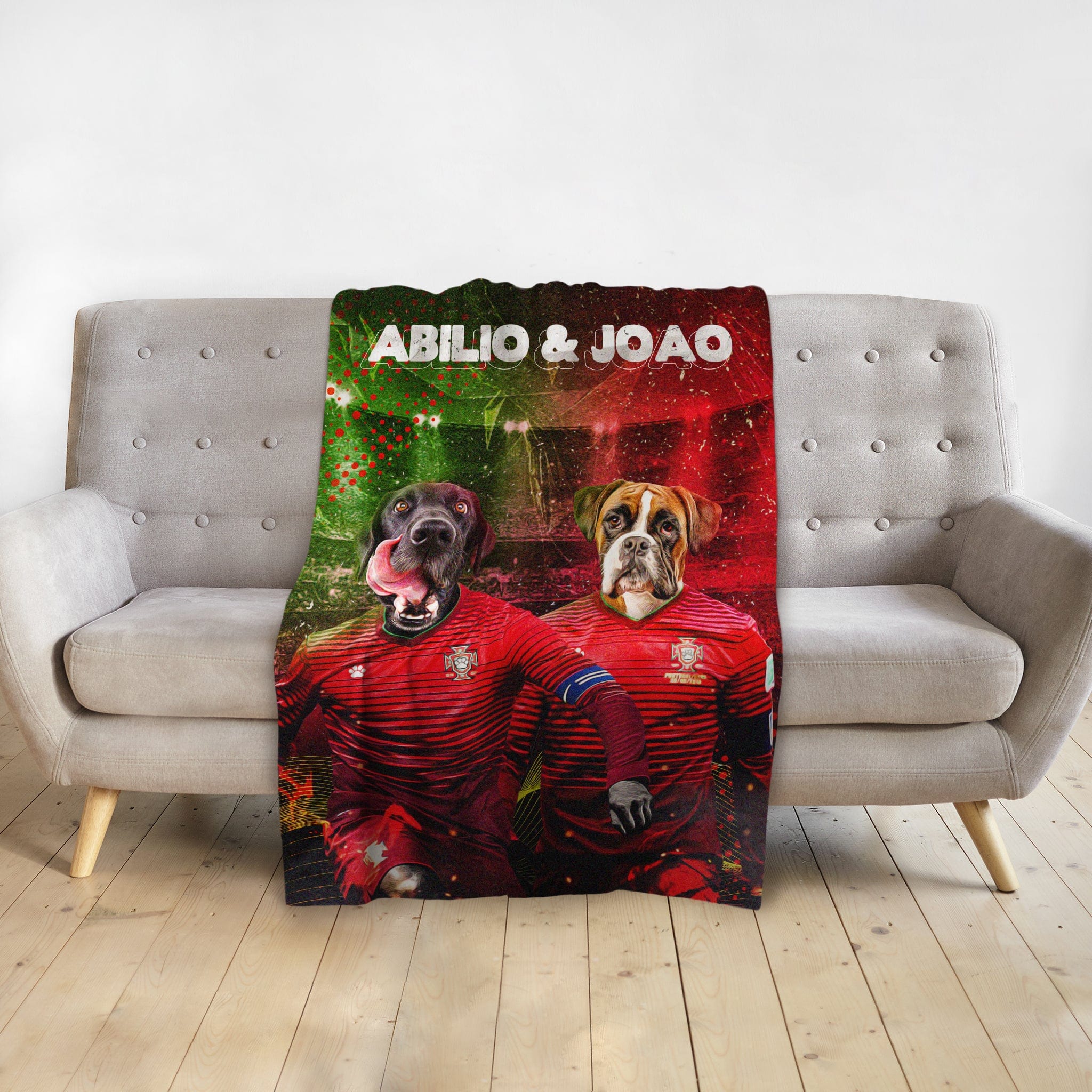 Personalized Portugal Doggos blanket with two dogs in soccer jerseys, named Abilio & Joao, on a sofa.
