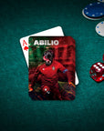 Personalized playing card featuring a black dog in a red soccer uniform, "ABILIO" text, on a green poker table.