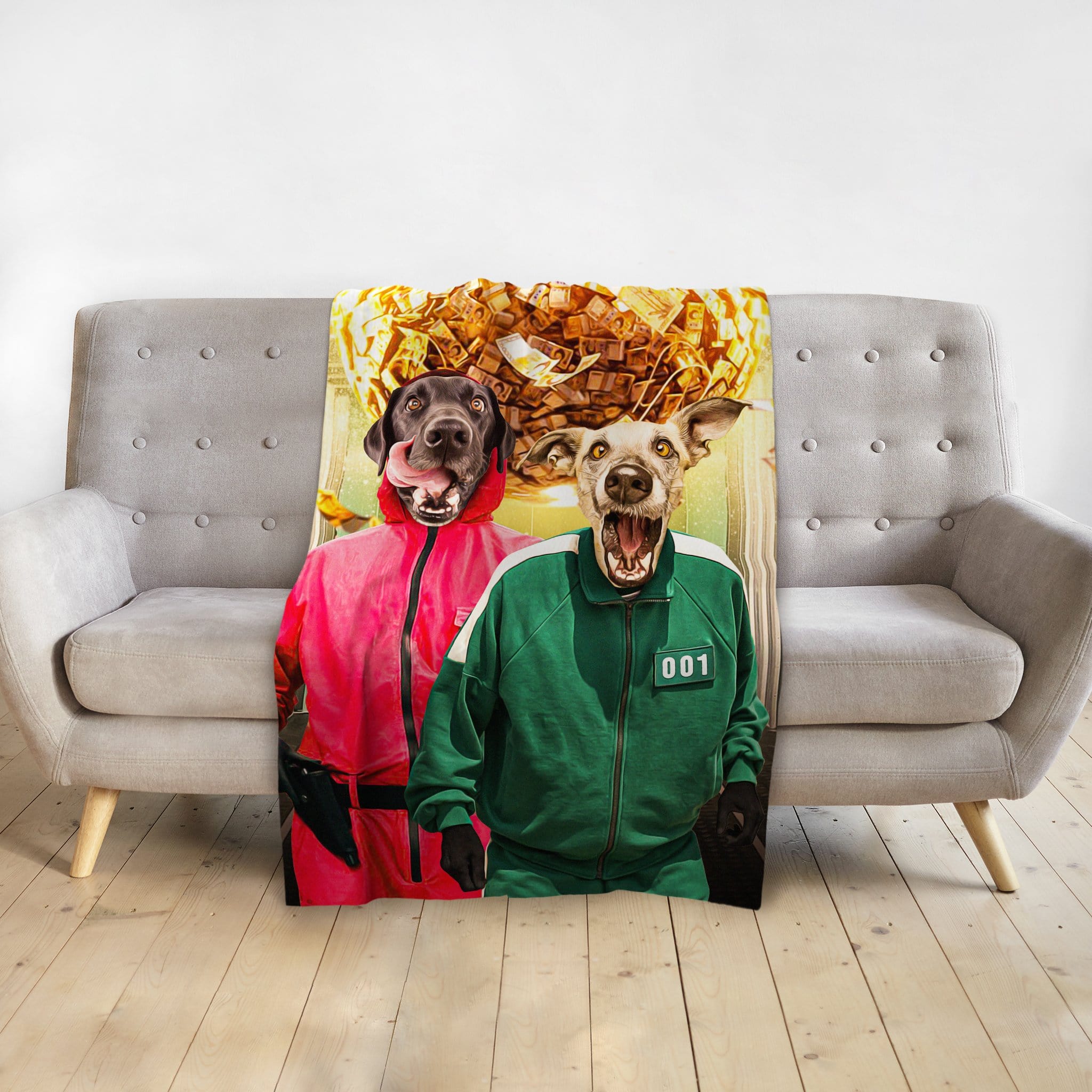 Personalized pet portrait blanket featuring two dogs in Squid Game costumes, draped over a gray couch.