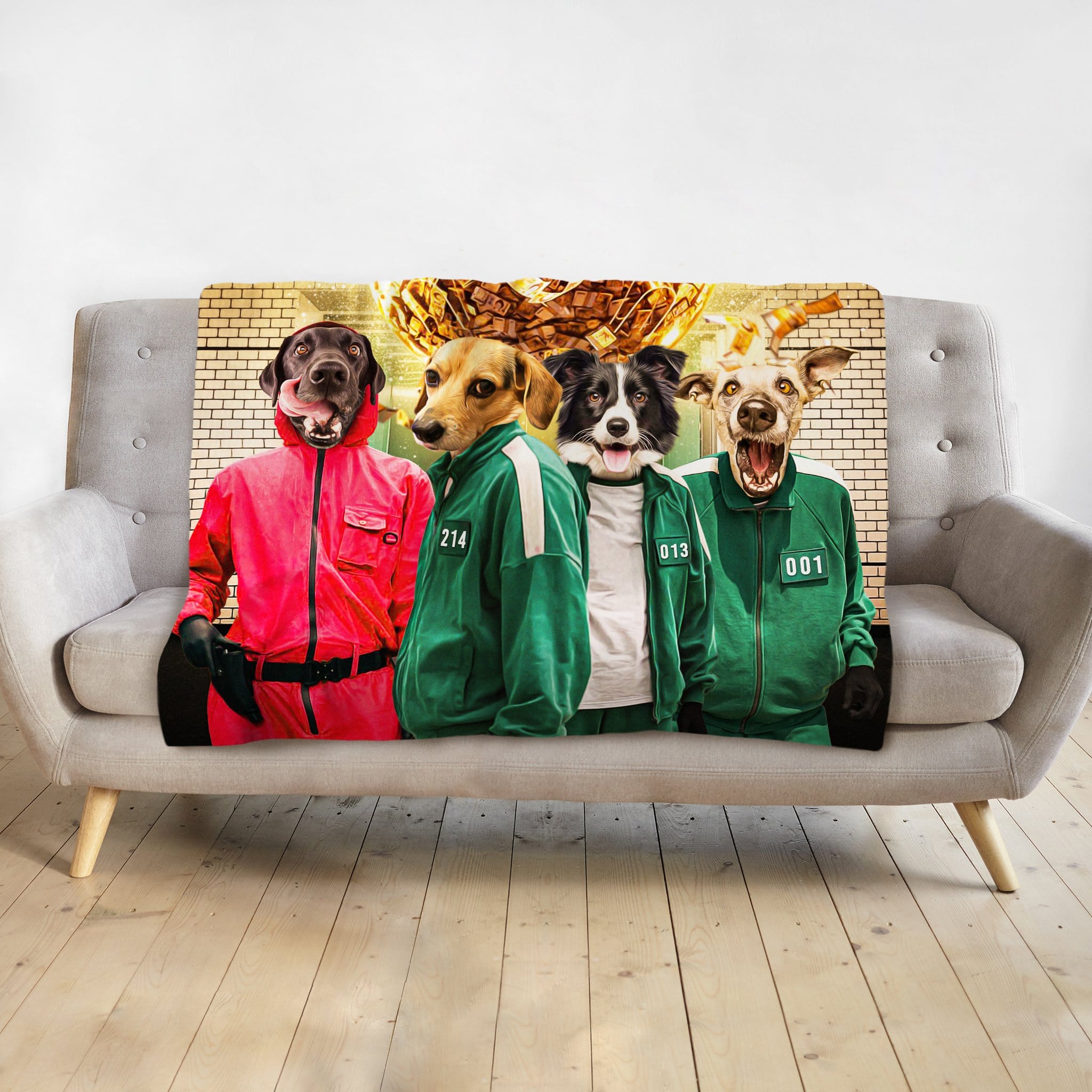 Personalized pet portrait blanket featuring four dogs in Squid Game costumes on a gray sofa.