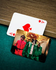 Personalized playing cards featuring four pets in Squid Game-style costumes on a green felt table.