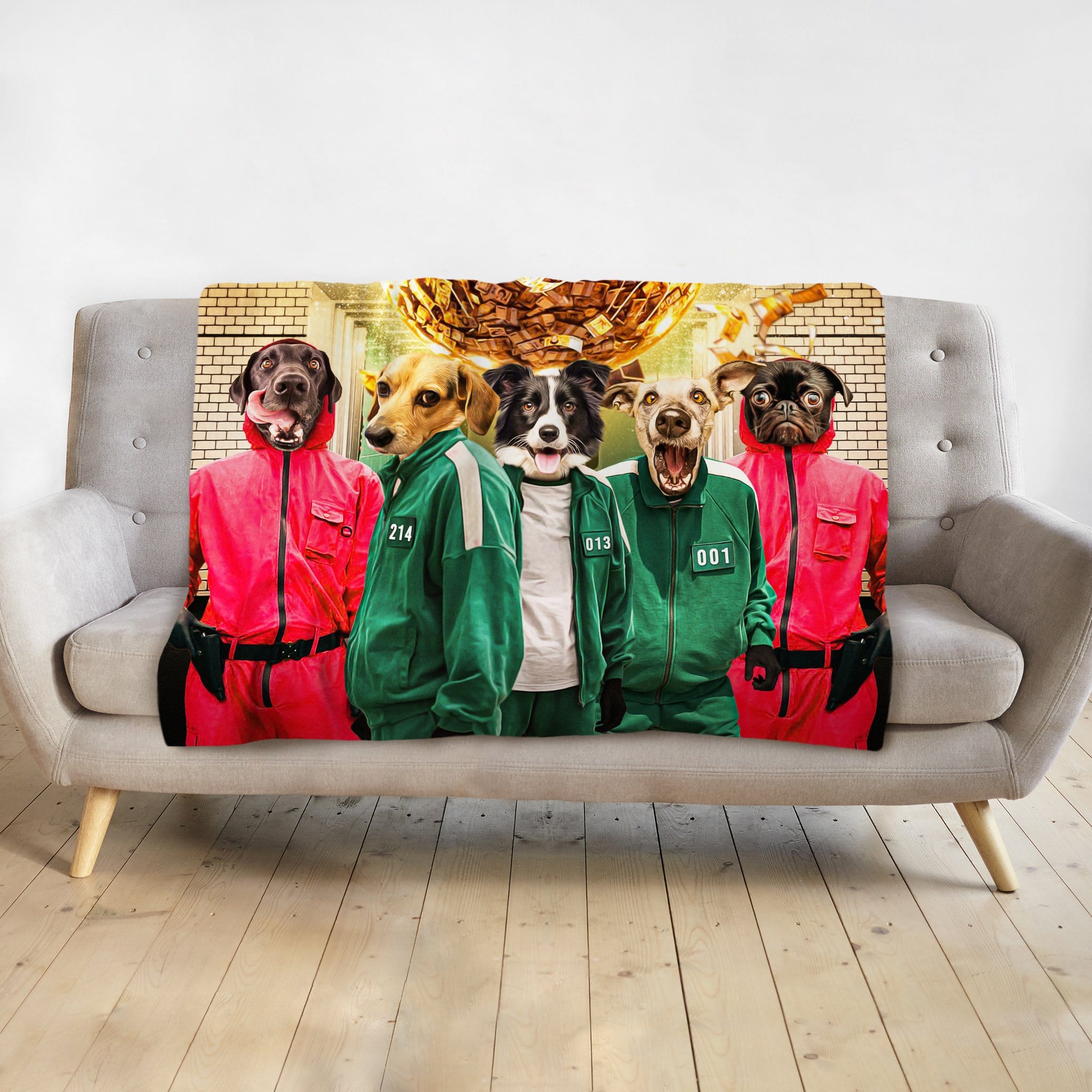 Personalized 5-pet blanket featuring dogs in red and green Squid Game-style costumes on a gray couch.