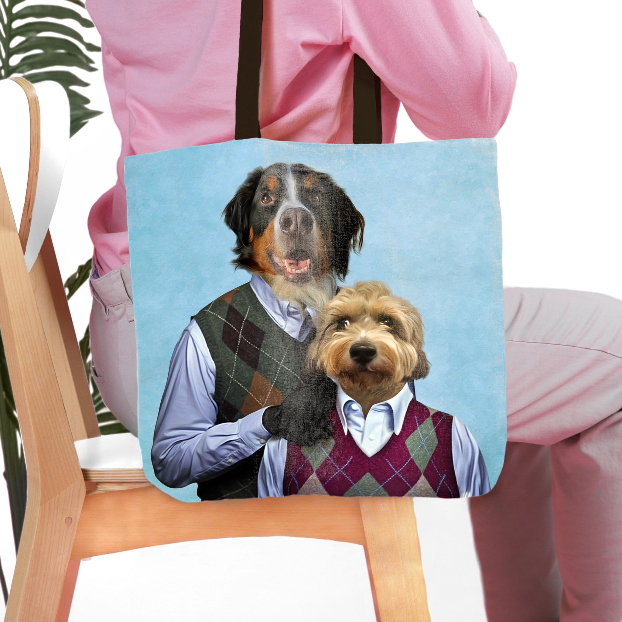 Personalized 2-pet tote bag with custom renaissance-style dog portraits on a light blue background.