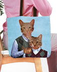 Personalized tote bag with two cat portraits in argyle sweaters on a light blue background.