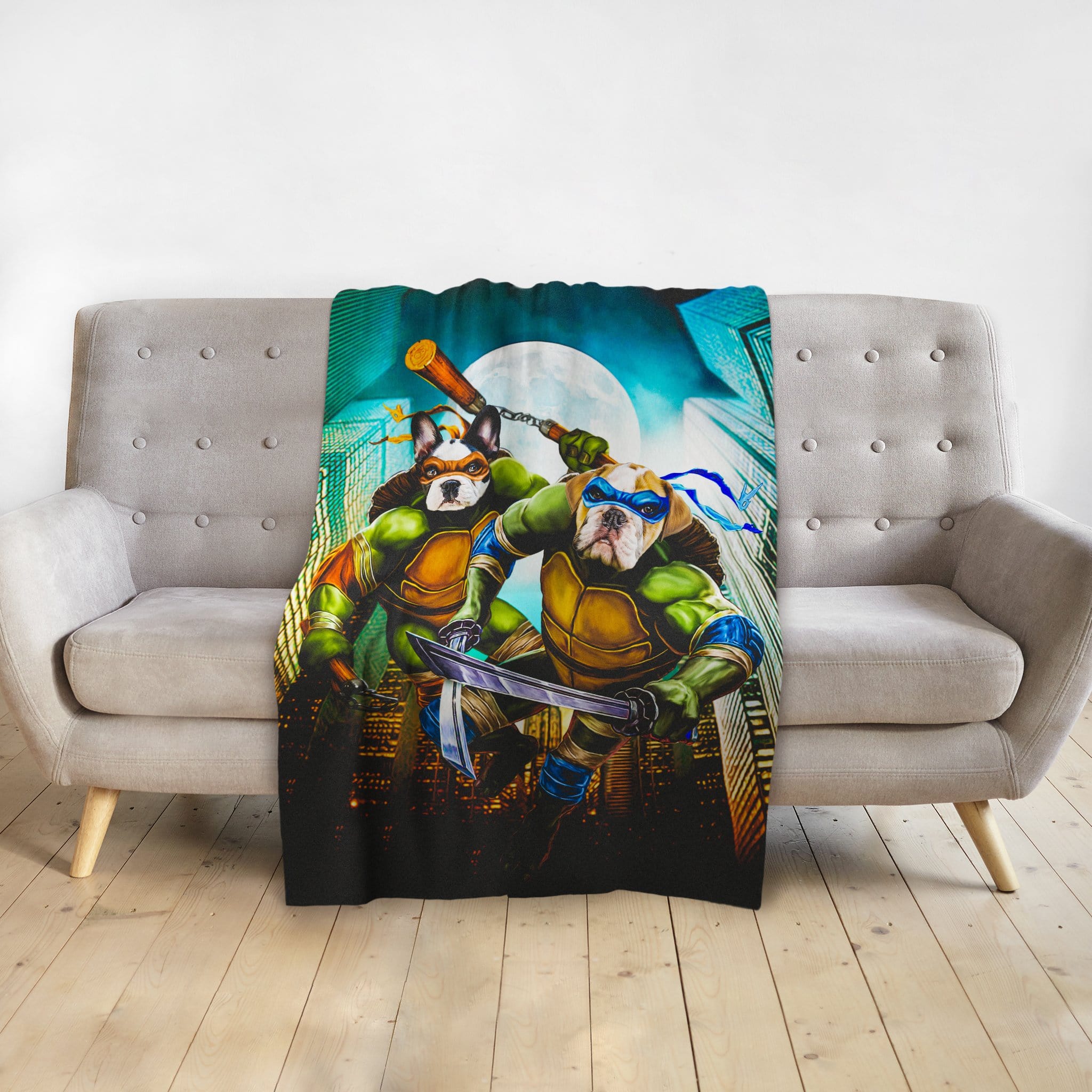 Custom pet blanket with two dogs as Ninja Turtles, on a gray couch.