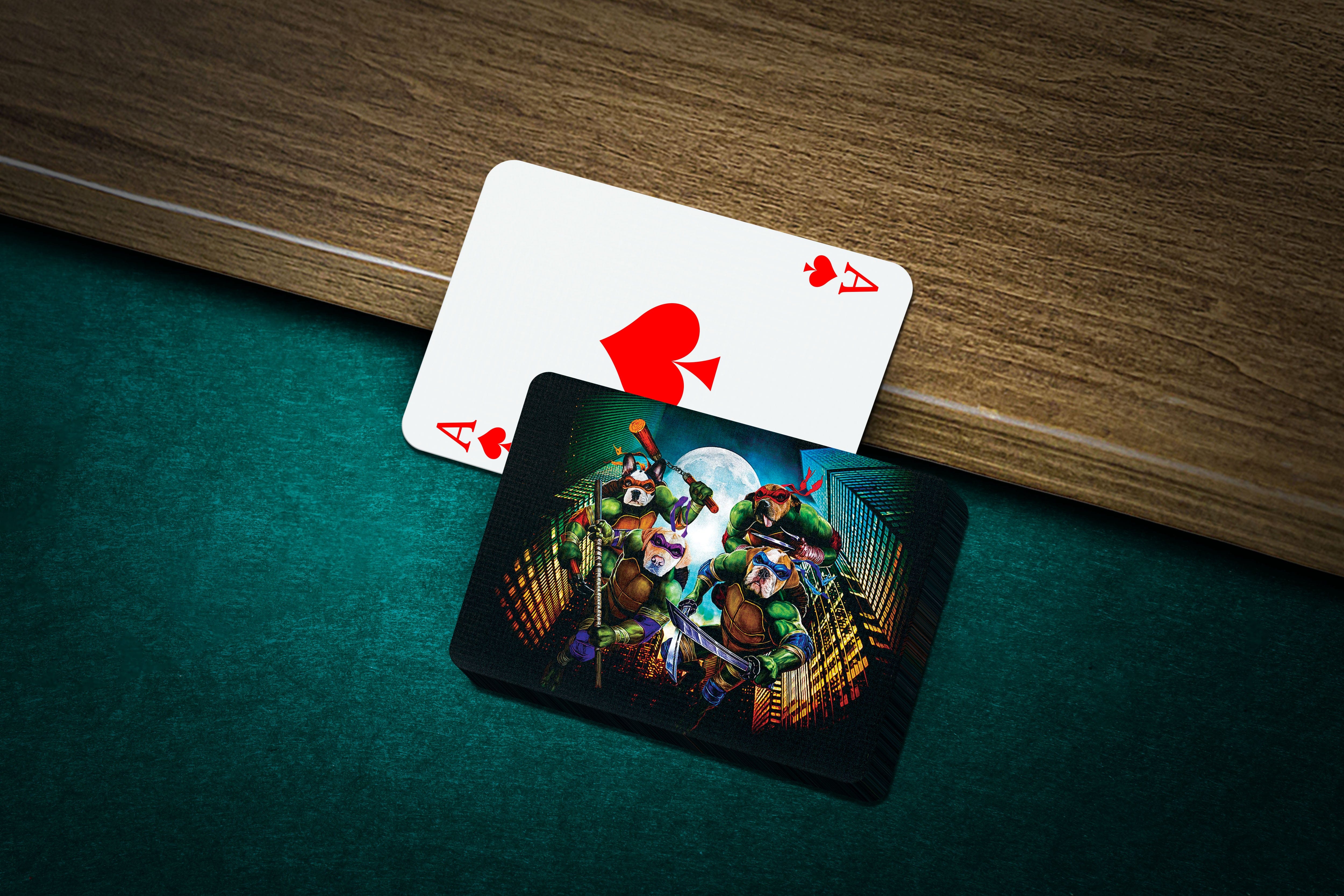 Personalized playing cards featuring four pets as "Teenage Mutant Ninja Doggos" on a dark green felt surface.