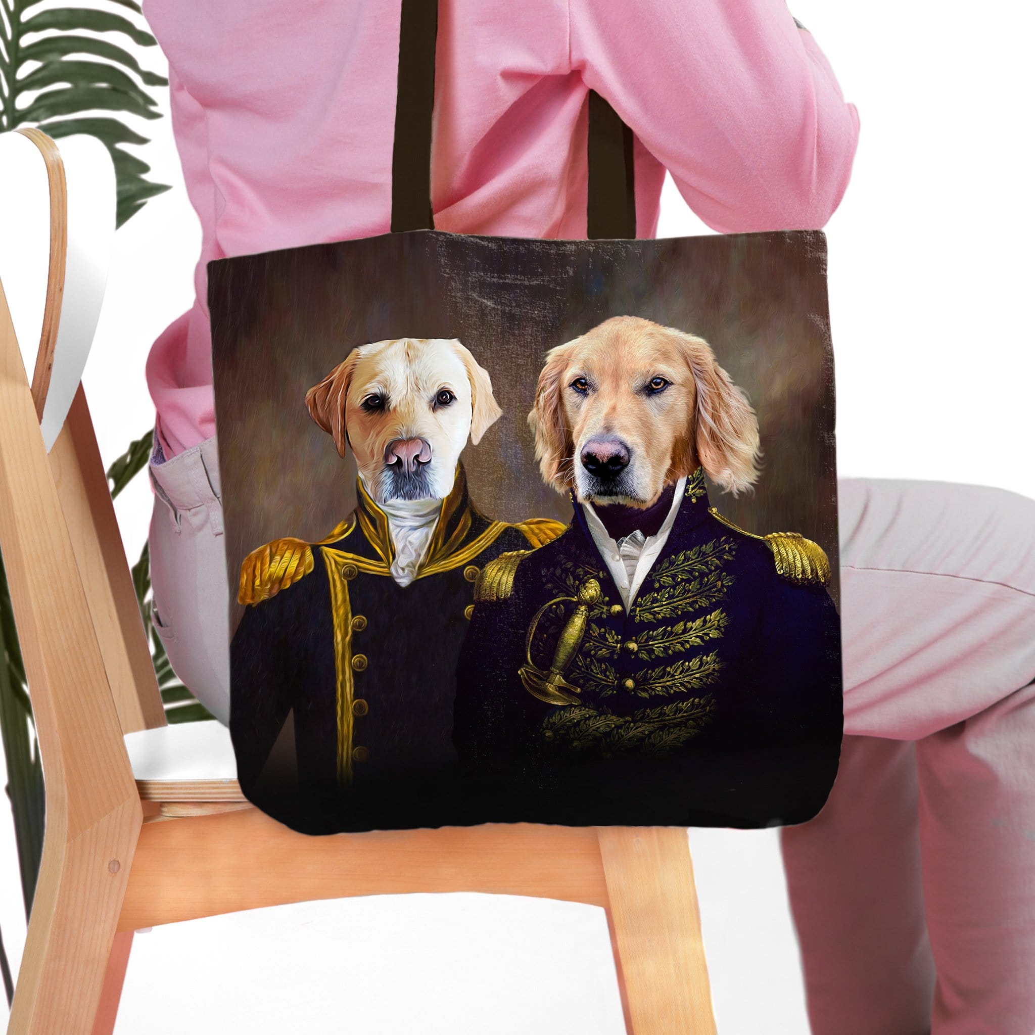 Personalized black tote bag with two custom pet portraits: a Labrador and a Golden Retriever in Admiral and Captain uniforms.