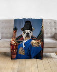 Custom pet blanket with a bulldog in a blue Asian Emperor portrait, draped over a gray couch.