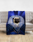 Personalized pet blanket with a pug in a royal blue renaissance portrait on a gray sofa.