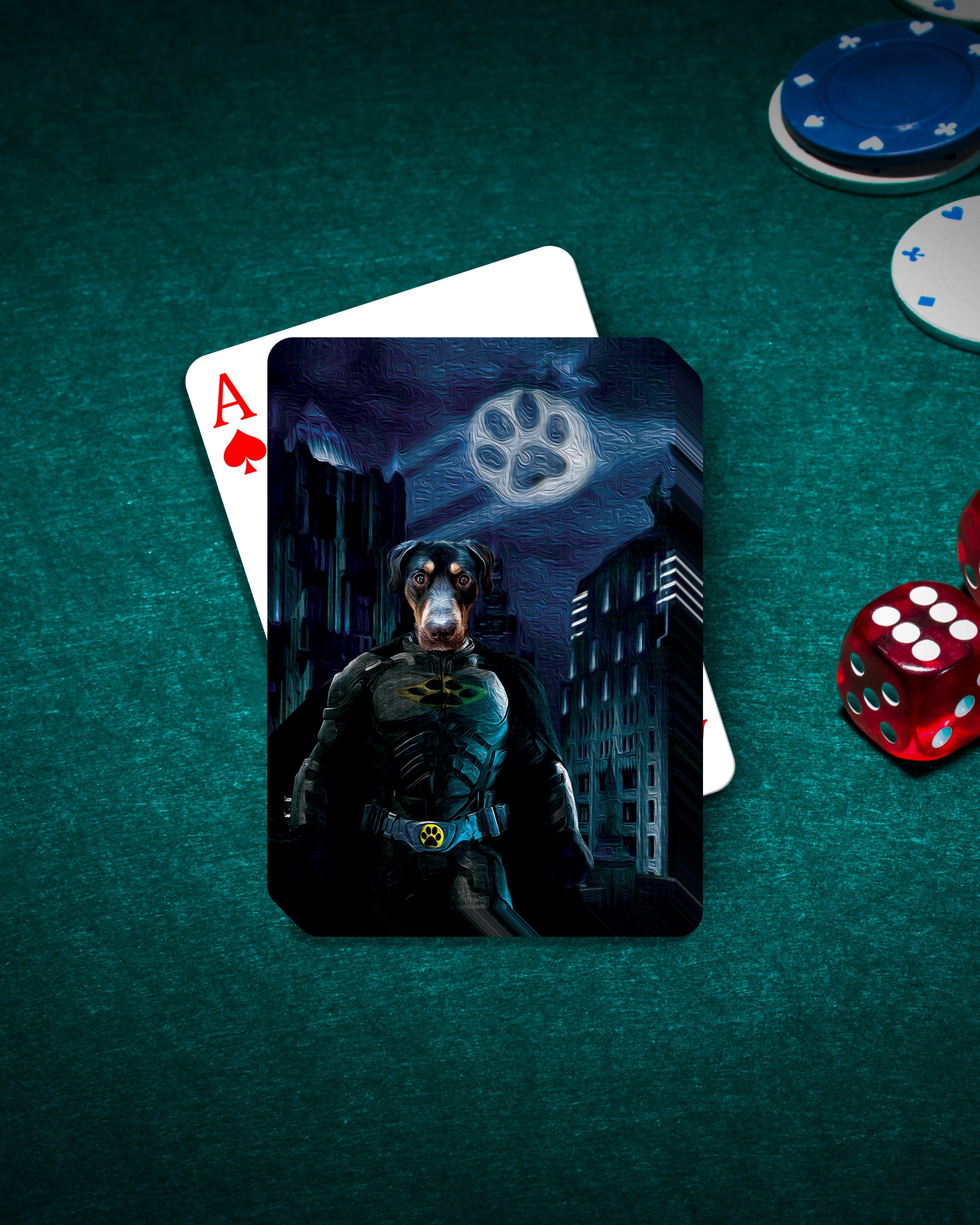 Personalized 'Batdog' playing card featuring a Doberman in a superhero costume, on a green felt table with chips and dice.