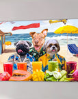 Three dogs in Hawaiian shirts on a beach canvas, with fruit and drinks in the foreground.